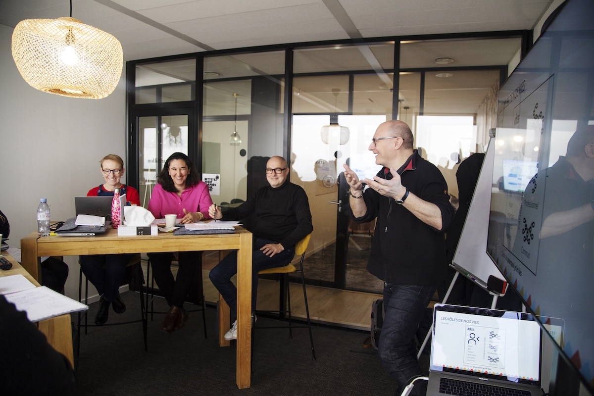 Équipe In Excelsis souriante lors d'une session de formation LeviMensa